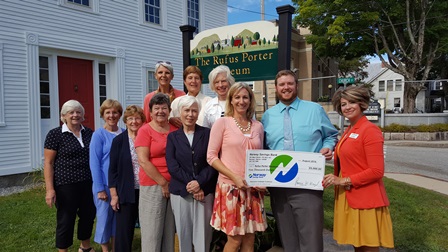 NSB employees present donation check to board members of the Rufus Porter Museum