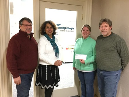 NSB employee presents check to Community Concept employees