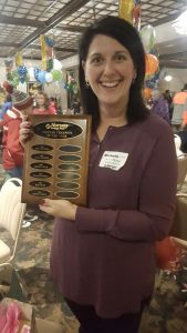 Person holding award