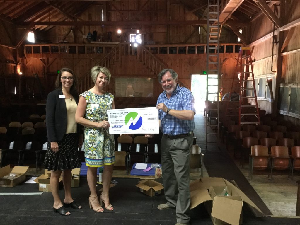 Group photo with check presentation