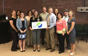 Group presenting big check