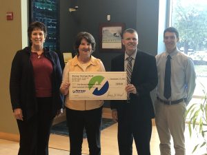 Group presenting big check