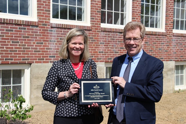 Two people holding award