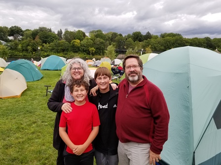 Kelly Sturmer and family surrounded by tents