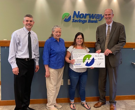 NSB employees presenting a check