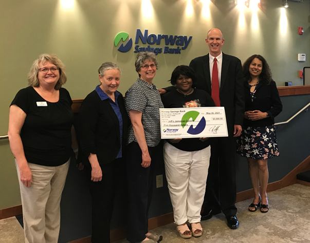 NSB employees presenting a check