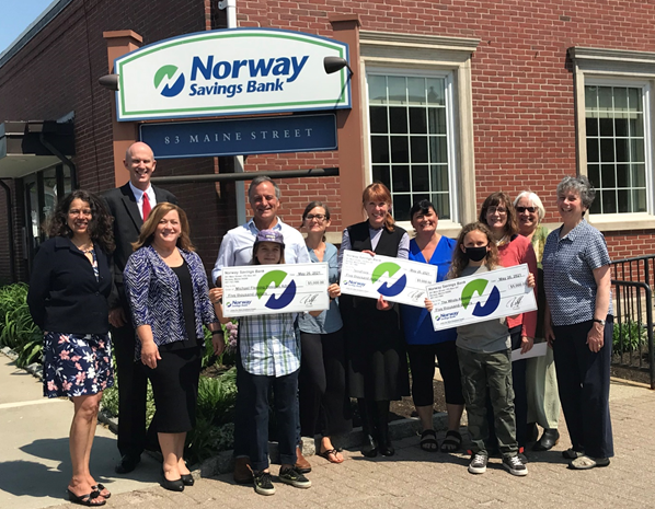 NSB employees presenting a check
