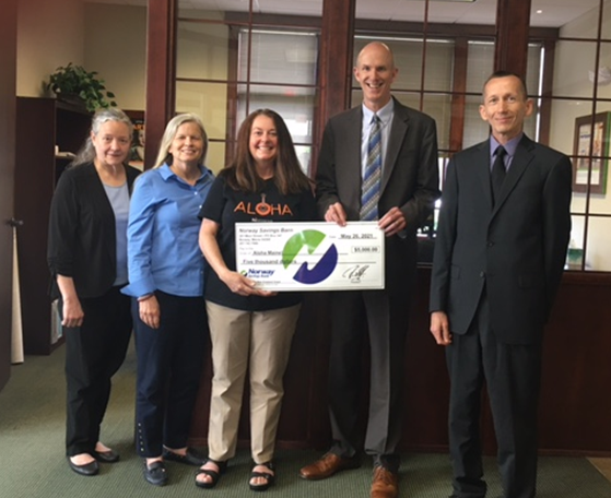 NSB employees presenting a check