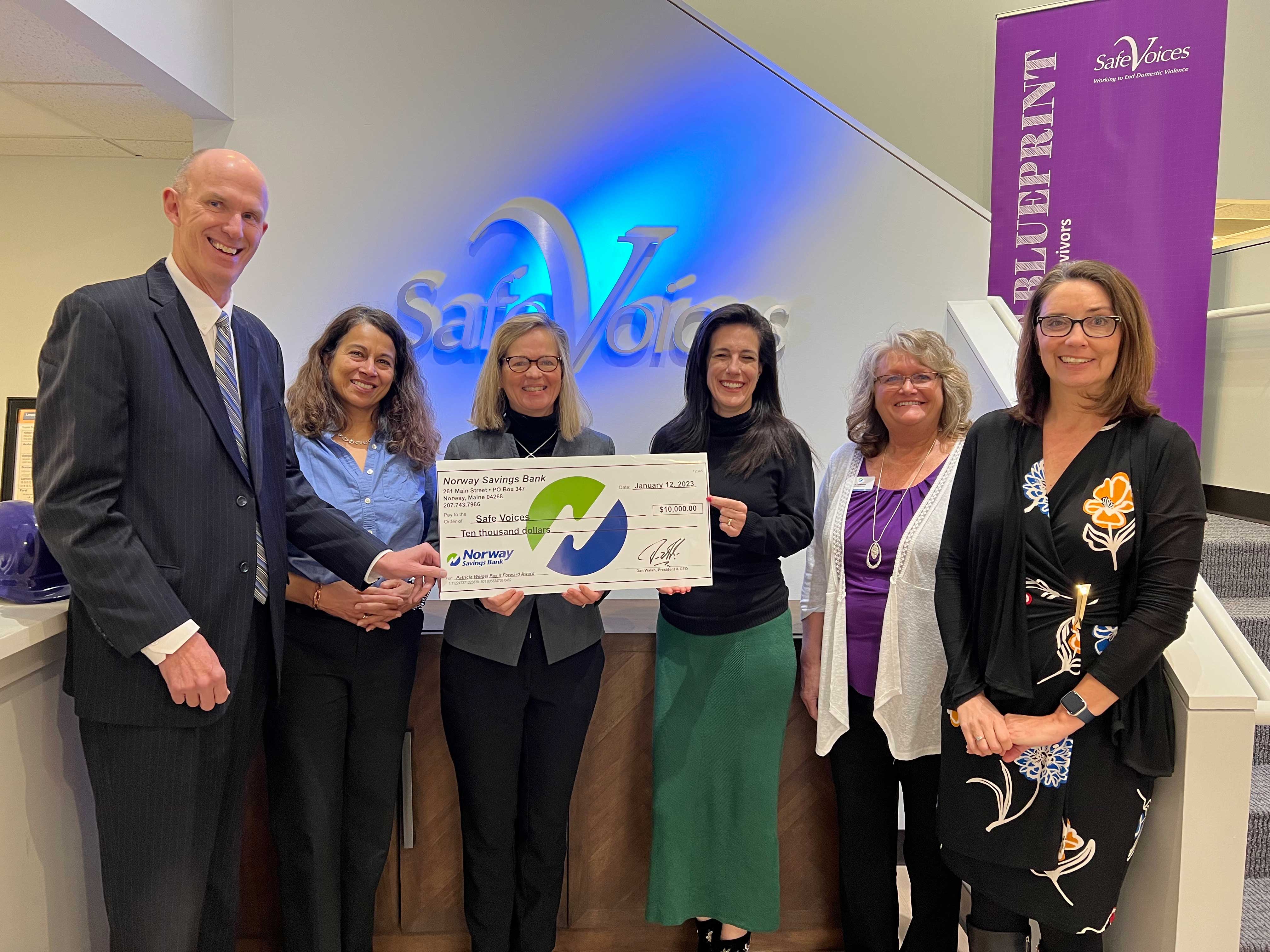 Group check presentation to Safe Voices