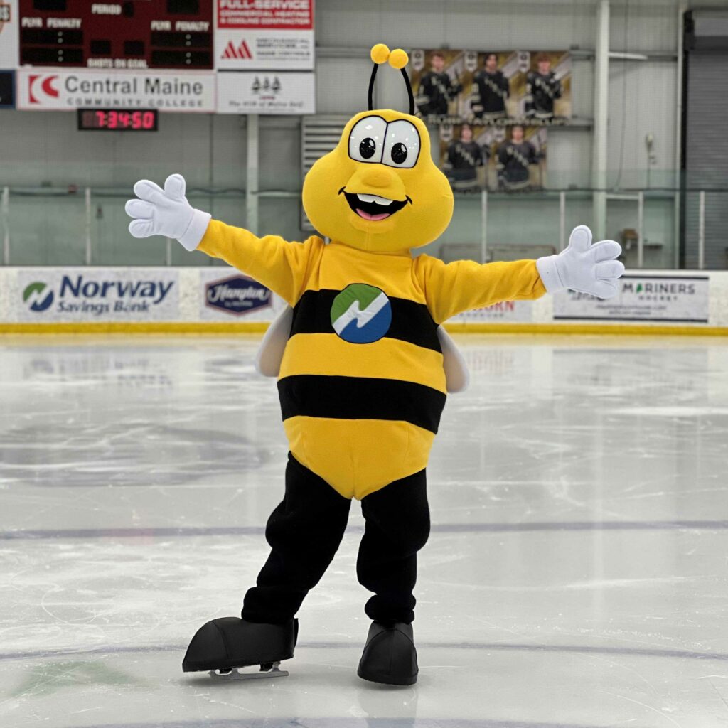 Friendly bee mascot with arms open wide is Norway Savings Bank mascot