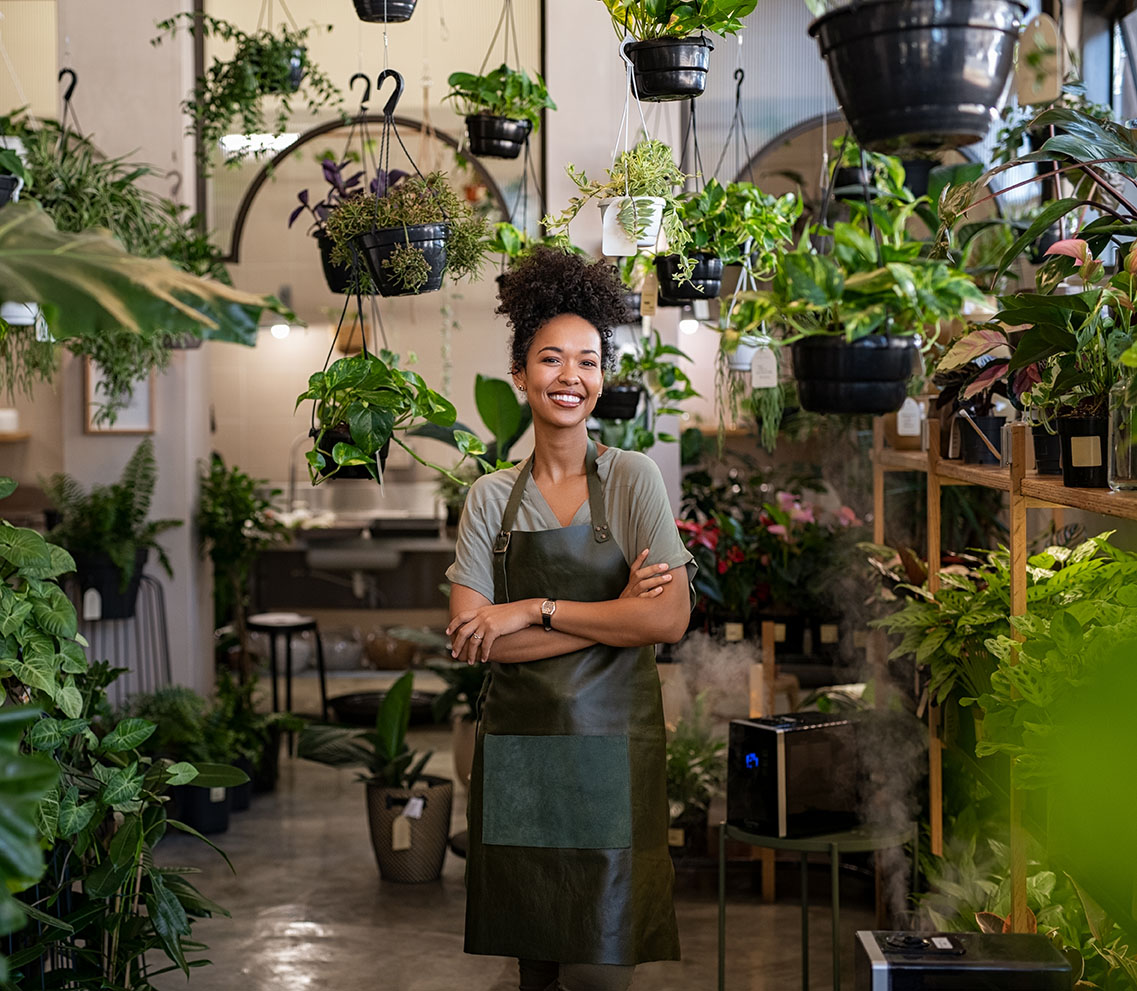 business woman smiling in her plant store business